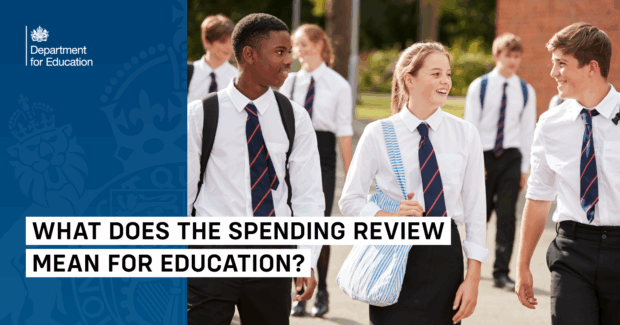 Group of secondary school students in uniform walking and smiling outdoors, with "What does the Spending Review mean for education?" text and Department for Education branding.